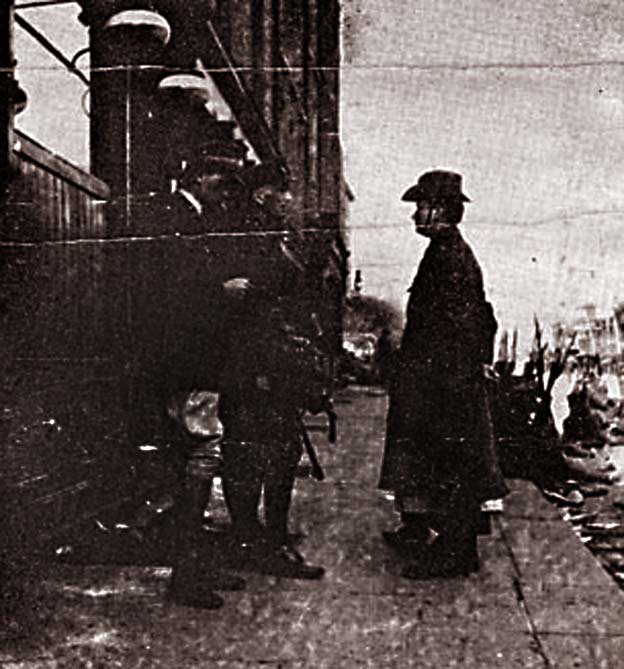 Patrick Pearse, accompanied by Elizabeth O'Farrell (partially hidden) surrender to General Lowe and his son after the Easter Rising in Dublin in 1916
